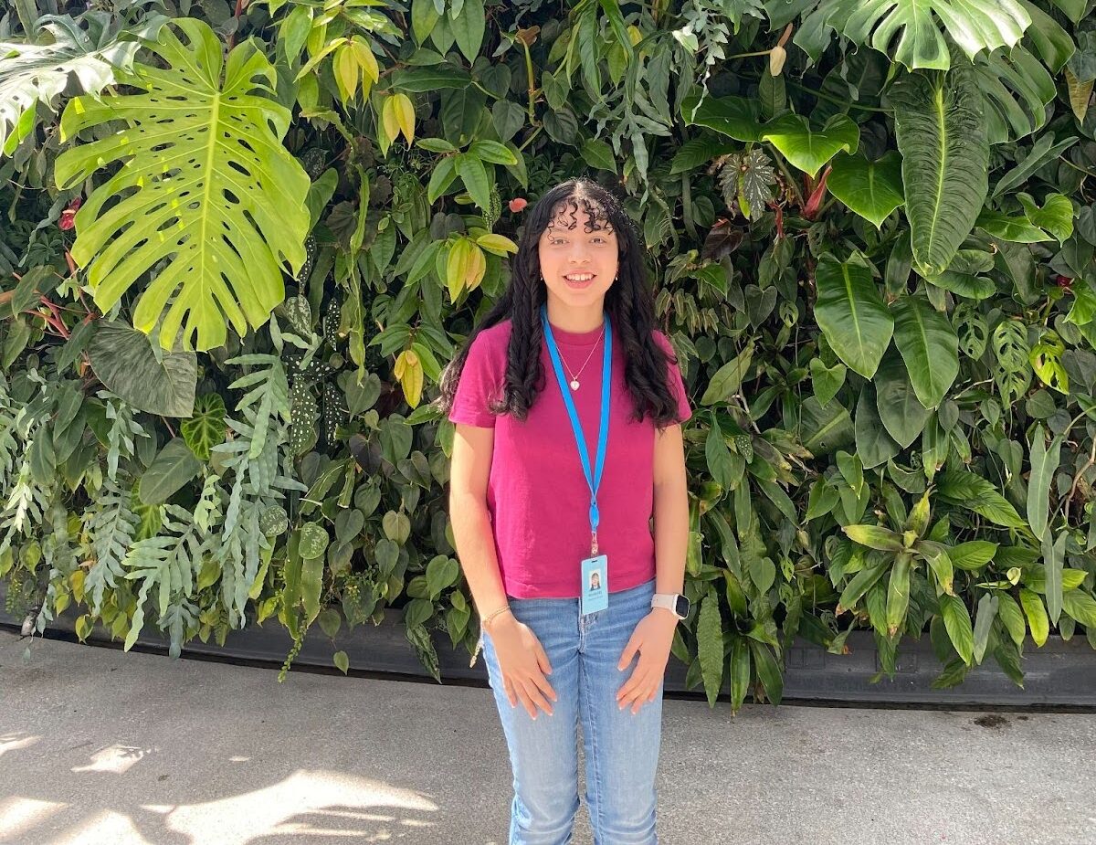 Arlington Tech Alumni standing in front of sign at Amazon headquarters